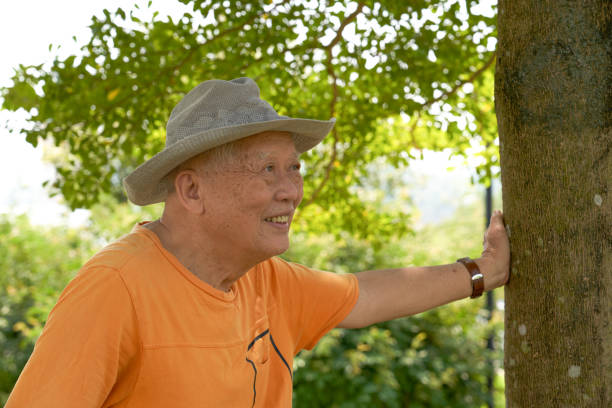 istock An old Asian man is happily visiting the park 2086518092