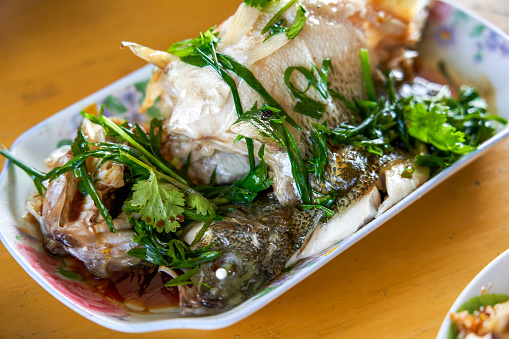 A delicious plate of home-cooked steamed sea bass