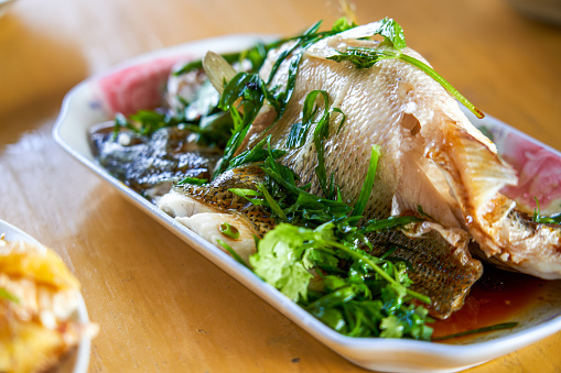 A delicious plate of home-cooked steamed sea bass
