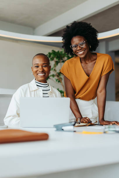 istock Two business women collaborating on a creative design project in a professional office 2086532147