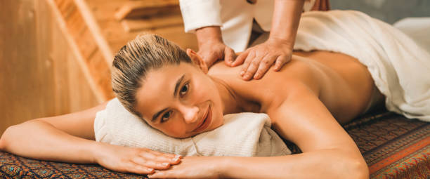 istock A pretty girl having a massage while looking at camera at sauna. Tranquility. 2086621461