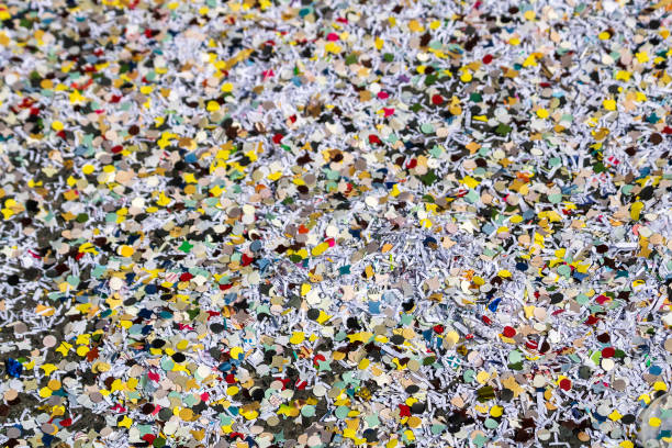 istock Carnival confetti on the street texture 2086626213