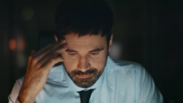 istock Disappointed employee sitting night office feeling despair close up. Tired man 2086651914