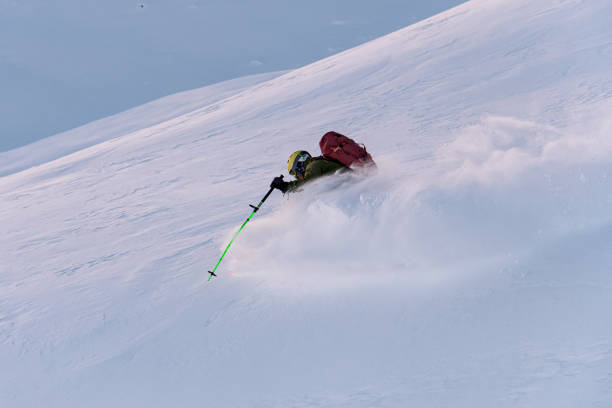 istock Skier descends a slope, drifting from side to side 2086669181