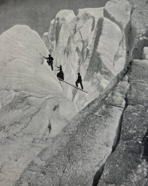 istock Antique illustration - mountain climbers crossing a crevasse 2086669213