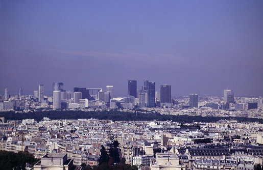 An aerial view, taken from an aircraft flying over the south of London, looking north towards St Paul's Cathedral (at the left of the image), and across to the cluster of modern towers in the City of London, the capital's main business and finance district.