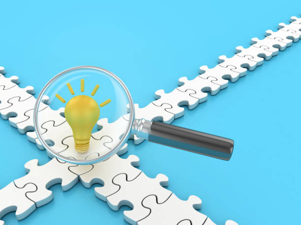istock Light Bulb with Puzzle and Magnifying Glass 2086677154