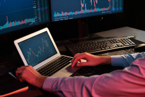 istock Investor stock trader searching on laptop compare dynamic exchange rate. Gusher. 2086685648