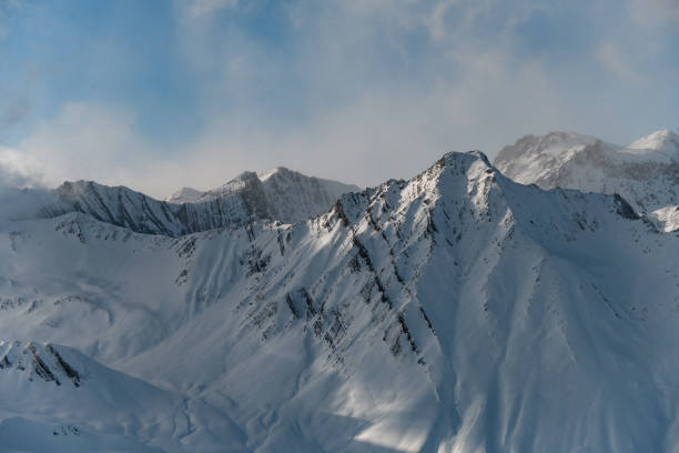 istock Mountain slopes are partially covered with white snow 2086696662