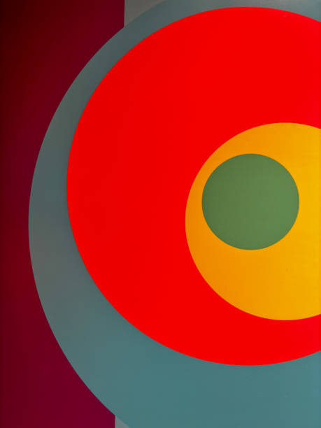 The image is a colorful abstract painting with four different colored circles. The circles are arranged in a striped pattern, with each circle being a different color. The painting has a vibrant