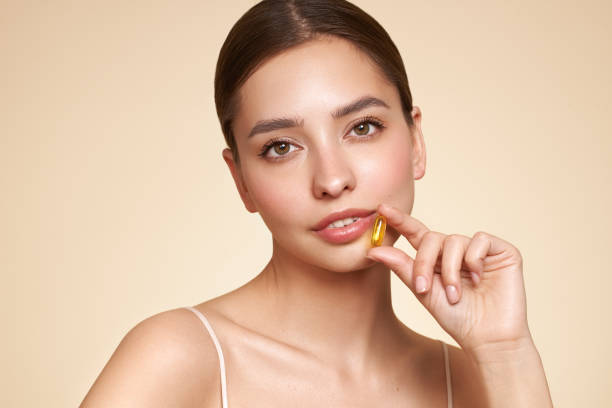 istock Beautiful Girl With Pill With Cod Liver Oil Omega-3 2086703599