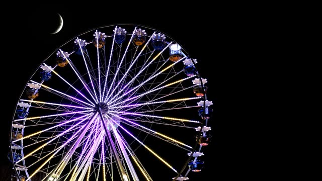 Festival. Ferris wheel. Coloured lights. Loopable.
