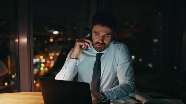 istock Overworked manager communicating telephone at office desk feeling stress closeup 2086715810