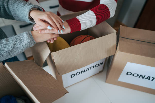 istock Young married couple packing their clothes for charitable organisation 2086731495