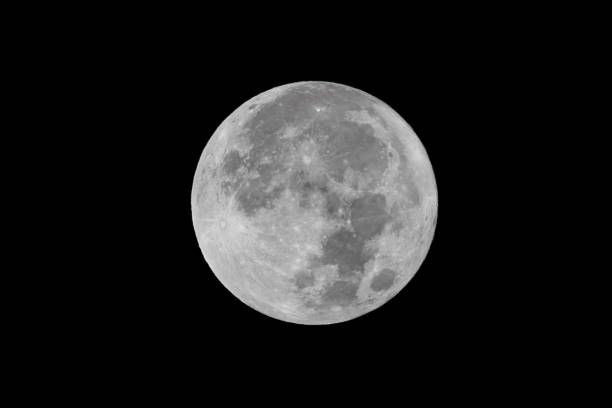 istock Full moon over dark black sky at night 2086750514