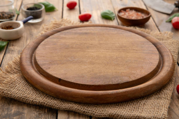 istock Empty round wooden cutting board for food, pizza. Mock up 2086752671