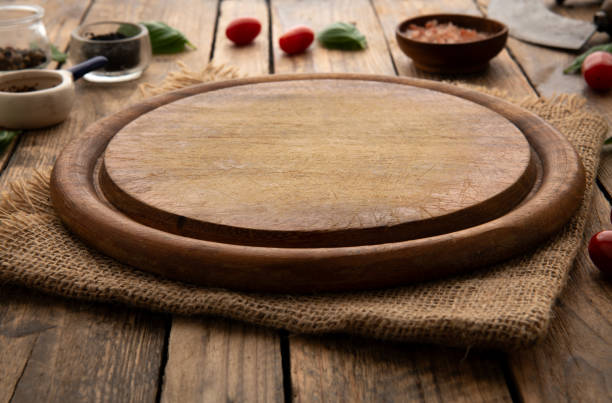 istock Empty round wooden cutting board for food, pizza. Mock up 2086753215