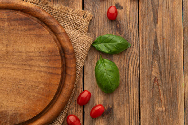 Empty round wooden cutting board for food, pizza. Menu, recipe Mock up.