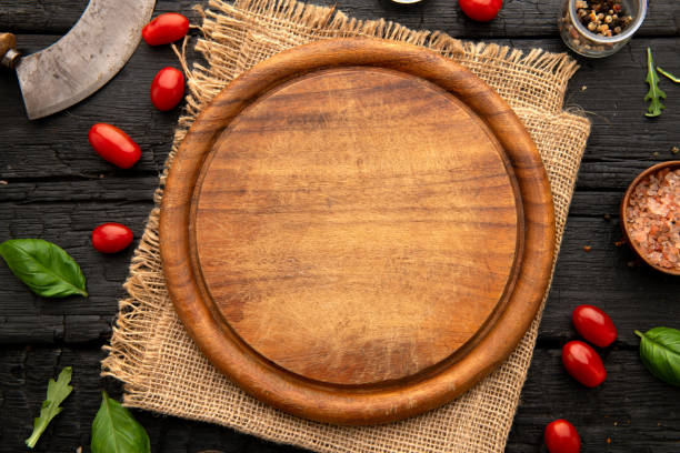 Empty round wooden cutting board for food, pizza. Mock up