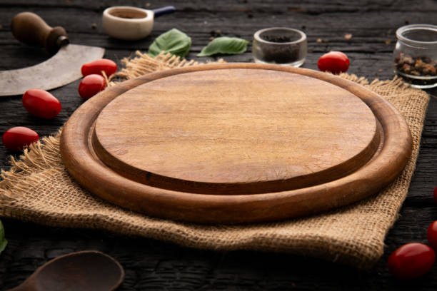 istock Empty round wooden cutting board for food, pizza. Mock up 2086754283