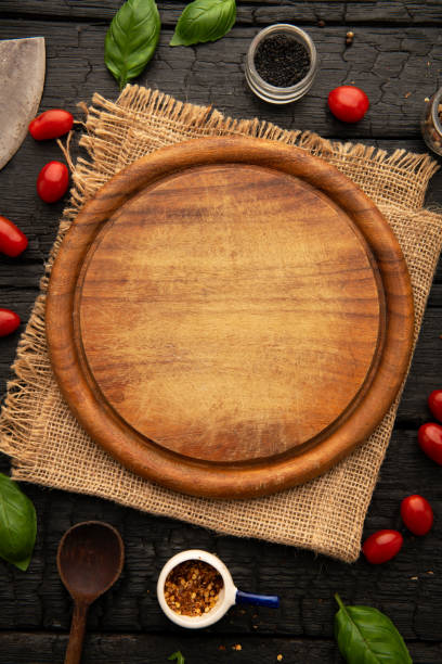 istock Empty round wooden cutting board for food, pizza. Mock up 2086754813
