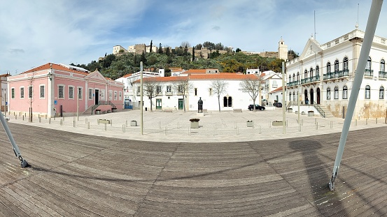 Pedro Nunes Square, in the historic center of the old town, panoramic shot, the hilltop Castle in the background, Alcacer do Sal, Portugal