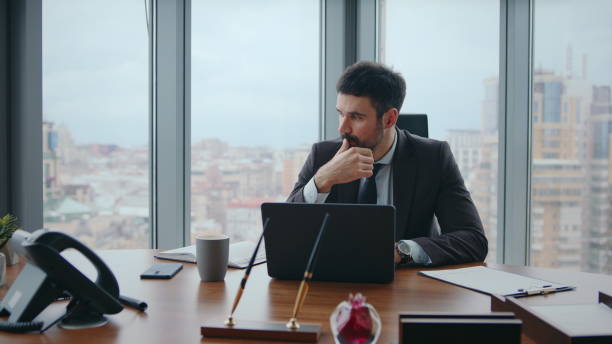 istock Busy office worker sitting luxury workplace thinking at company crisis close up. 2086781376