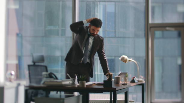 istock Exhausted business man worried by business problem standing luxury workplace. 2086812222