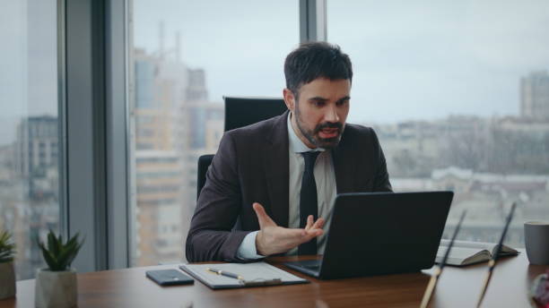 istock Nervous boss talking video meeting sitting office closeup. Manager videocalling 2086814858