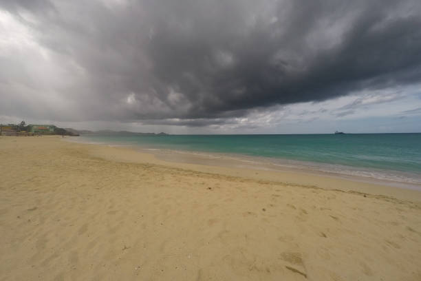 Caribbean beach with white sand, deep blue sky and turquoise water