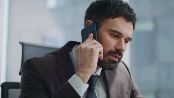 istock Office manager speaking cellphone sitting workplace closeup. Man discussing work 2086839590
