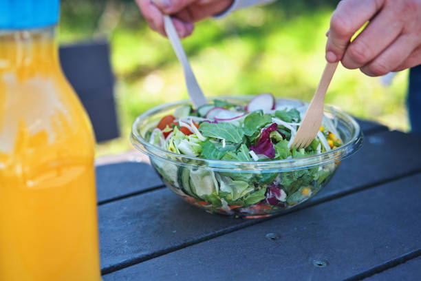 istock Eating Mixed Salad Bowl  from Plastic Packaging Outside 2086842293