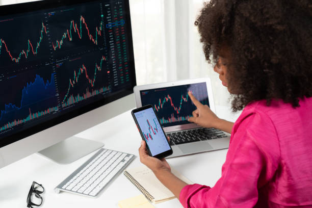 istock African woman blogger looking on computer screen and smartphone. Tastemaker. 2086846492