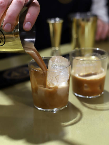 istock barman serving cocktail with ice and coffee cream liqueur 2086856435
