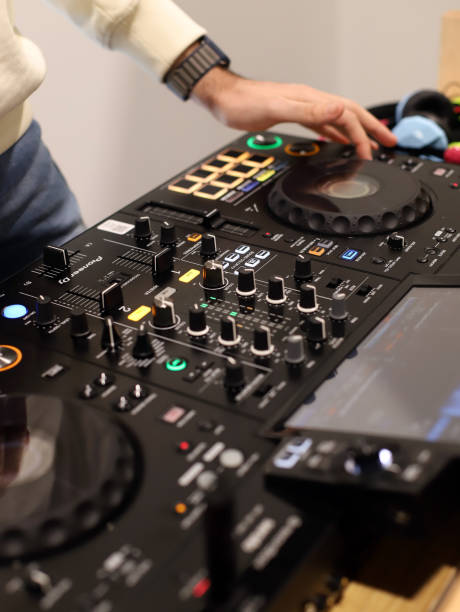 istock techno music artist working with a mixing console 2086856972