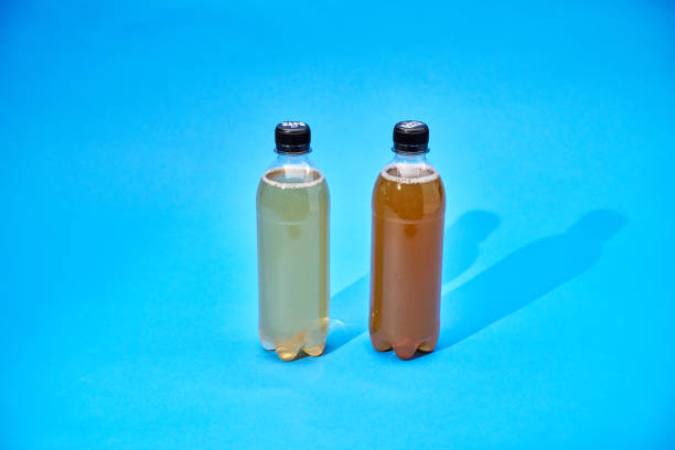 Iced Tea in Recycled PET Plastic Bottles on Blue Background