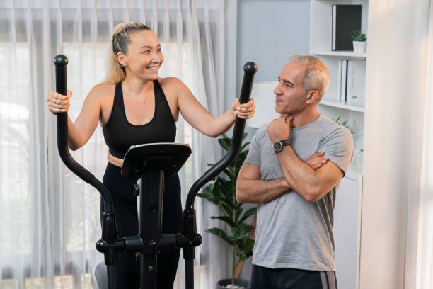 istock Active senior couple running on elliptical running machine. Clout 2086891337