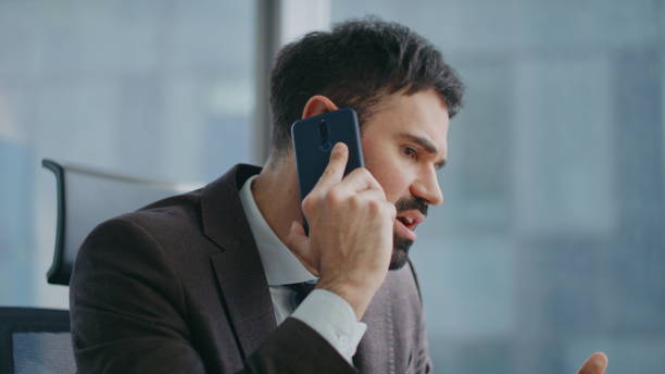 istock Businessman discussing work phone conversation sitting modern office close up. 2086892161