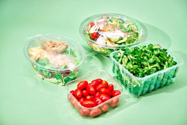 istock Various Salad Bowls in Plastic Container on Green Background 2086899518
