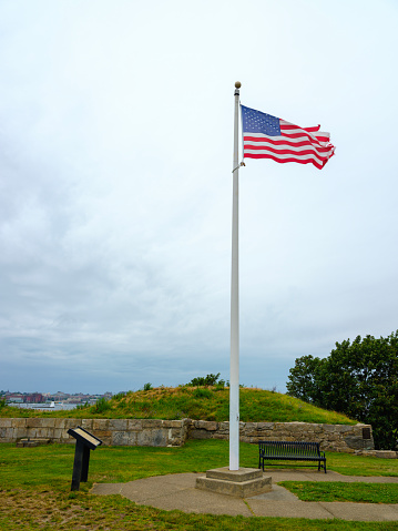 American flag waving in the memorial park in Providence, Rhodes Island at Fort Taber Park in New Bedford,  Massachusetts, USA