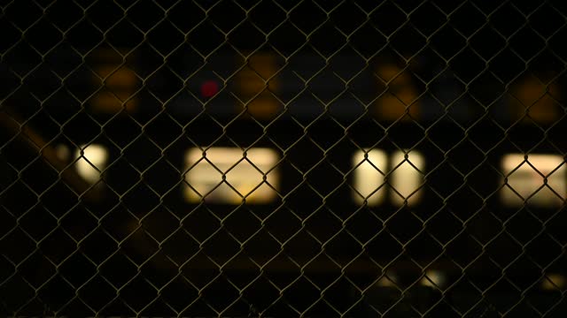 Video of Subway Train Passing Behind Chainlink Fence NYC