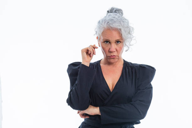 istock mature latin woman looking at the camera that portrays her executively dressed 2086960094