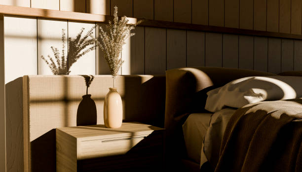 vase with plant on bedroom table next to the bed 3d render image with light coming through the window, front view