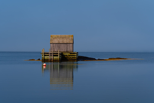 Boat house on the shoreline of Blue Rocks, Nova Scotia.