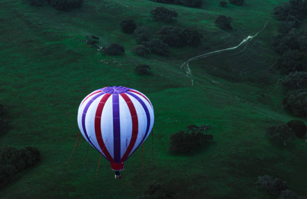 Hot air balloon in flight through Carmel ValleyTaken in Carmel Valley, California, USA.