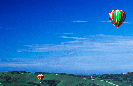 Hot air balloons in flight through Carmel Valley\n\nTaken in Carmel Valley, California, USA.