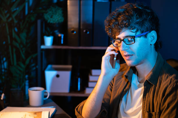 istock Young businessman calling on phone to customer or coworker. Gusher. 2087019517