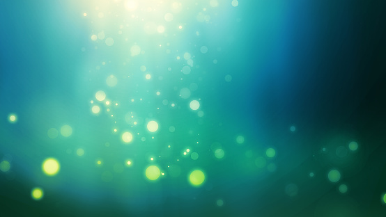 falling golden defocused particles with greenish light