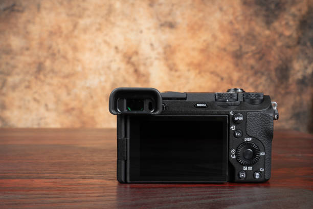 istock Back of a camera on a mahogany table 2087071886