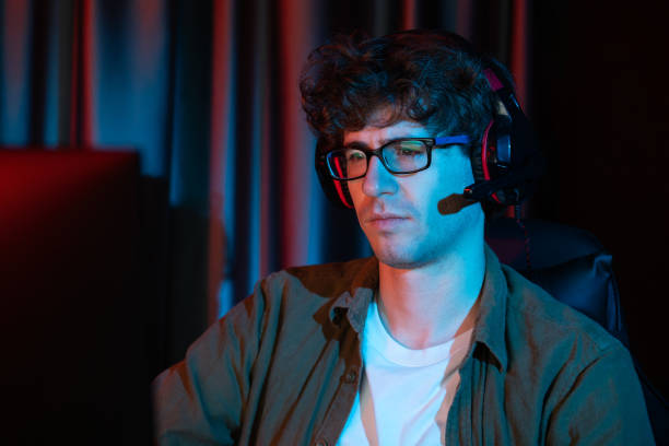 istock Streamer concentrated with Esport team on computer with harder game. Gusher. 2087091967